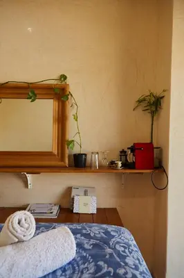 a bedroom with a bed and a mirror on a shelf at Mosaics Athens Penthouse with Acropolis view in Athens