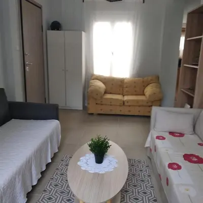 a living room with a coffee table and a couch at CENTRAL TOWN HOUSE 60m2**** in Piraeus