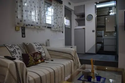 a living room with a couch and a glass table at h2h Anthi #Comfort apt near Athens in Athens