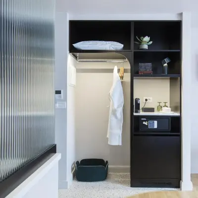 a bathroom with a sink and a towel on a shelf at L'Avventura Athens in Athens