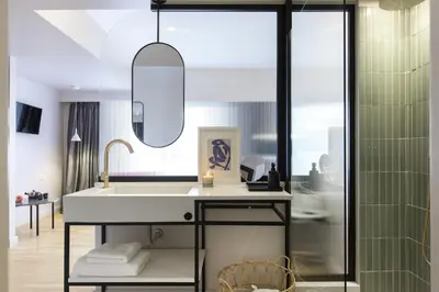 a bathroom with a sink and a mirror at L'Avventura Athens in Athens
