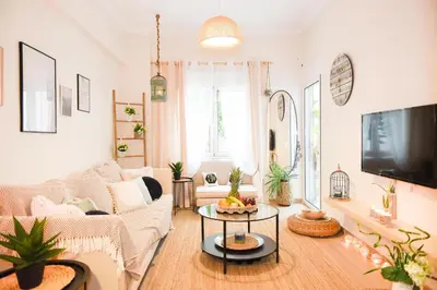 a living room with a couch and a tv at Acropolis Sweet House 2 in Athens