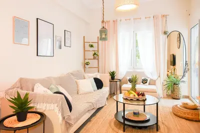 a living room with a couch and a table at Acropolis Sweet House 2 in Athens