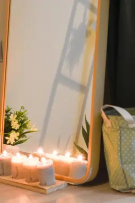 a group of candles in front of a mirror at Acropolis Sweet House 2 in Athens