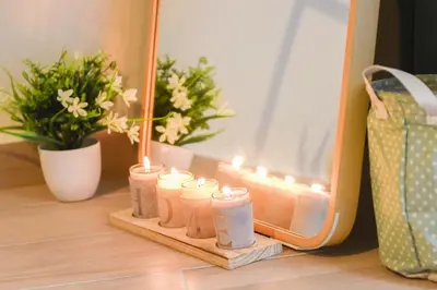 a group of candles sitting on a table next to a mirror at Acropolis Sweet House 2 in Athens