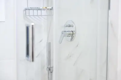 a shower with a shower head in a bathroom at Acropolis Sweet House 2 in Athens