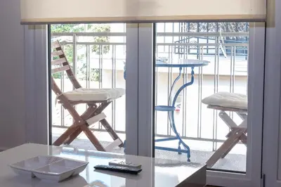 a view of a balcony with a table and a chair at Plaka Sweet House 2 in Athens