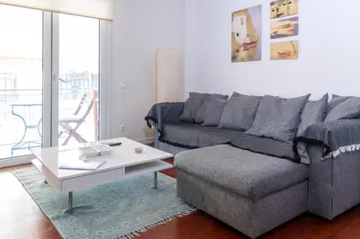 a living room with a couch and a coffee table at Plaka Sweet House 2 in Athens