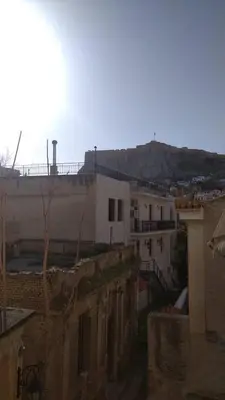 a view of a city with buildings and a mountain at Plaka Sweet House 1 in Athens