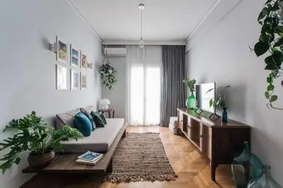 a living room with a couch and a table at Cosy flat, perfectly located in historic centre! in Athens