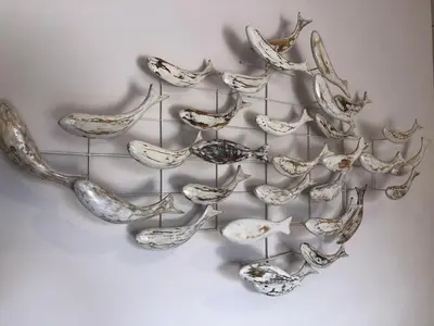 a group of birds sculpture on a wall at Lemon Tree Inn in Markopoulo