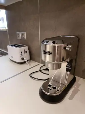 a mixer sitting on a counter next to a toaster at Casa Moderno near the beach in Athens
