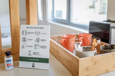 a box sitting on top of a counter with cups at LOFUS Bio-Suites in Athens