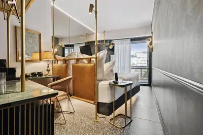 a hotel room with a bed and a desk at Skylark, Aluma Hotels & Resorts in Athens