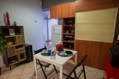 a kitchen with a table and chairs and a refrigerator at 