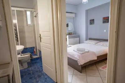 a bedroom with a bed and a bathroom with a toilet at 