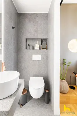 a bathroom with a white toilet and a sink at Urban Views, Modern Apartment In The Heart of Athens in Athens