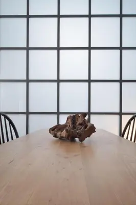 a wooden table with chairs and a skull on it at Twin Circle Athens in Athens