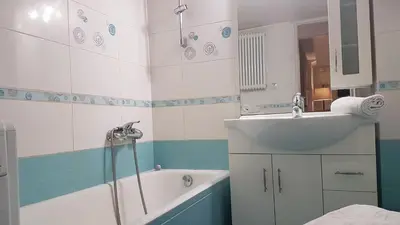 a bathroom with a tub and a sink at Petrol Apartment- Athens Center, 4 BD, 1 BATH in Athens
