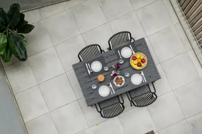 an overhead view of a table with chairs and a bowl of fruit at Trikoupi 95 in Athens