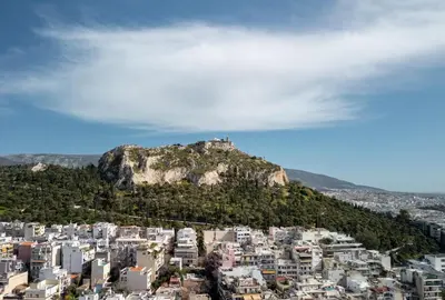a mountain with a castle on top of it at Trikoupi 95 in Athens