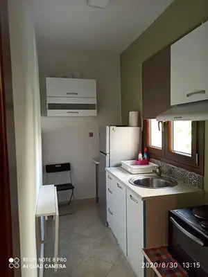 a small kitchen with a sink and a refrigerator at Παιδων στουντιο 3 in Athens