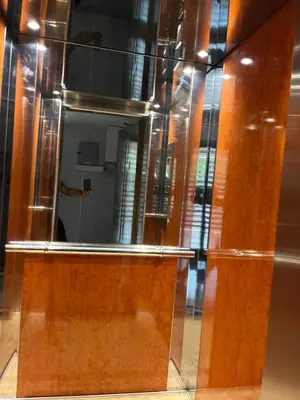 a mirror on a wooden door in a room at Παιδων στουντιο 3 in Athens