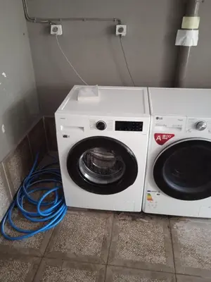 a washing machine and a washer in a room at Παιδων στουντιο 3 in Athens