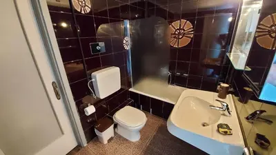 a bathroom with a toilet and a sink at METROPOLITAN MACVIEW-3 διαμέρισμα studio Φάληρο in Piraeus