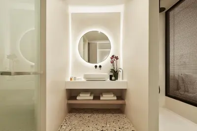 a bathroom with a sink and a mirror at Vasi in Athens