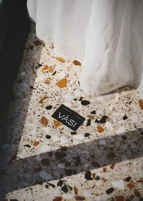a smashed bathroom floor with a kiss sign on it at Vasi in Athens