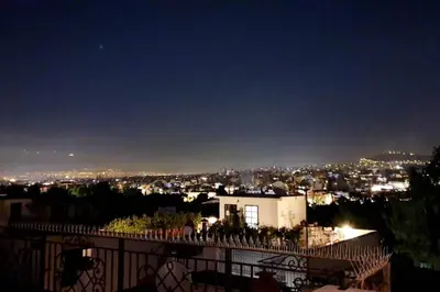 a view of a city at night at Ground floor apt with rooftop and stunning view in Athens