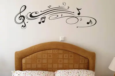 a bedroom with a bed with music notes on the wall at Ground floor apt with rooftop and stunning view in Athens