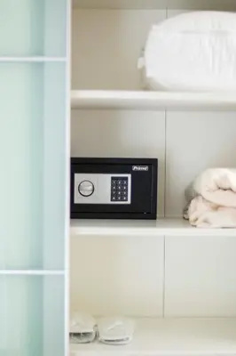 a microwave on a shelf in a closet at Marina's Luxury Apartment close to Acropolis in Athens
