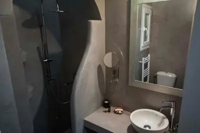 a bathroom with a sink and a shower and a mirror at Marina's Luxury Apartment close to Acropolis in Athens