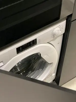a white microwave oven with a washing machine at CASAGOLD Glyfada Luxury Apartment Near The Sea in Athens
