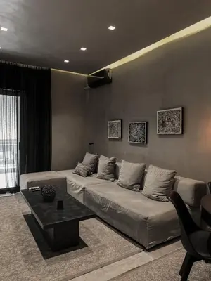 a living room with a couch and a table at CASAGOLD Glyfada Luxury Apartment Near The Sea in Athens