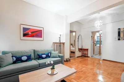 a living room with a couch and a table at Elegant Ariadne, 2 Bedroom Apartment, by Acropolin in Athens