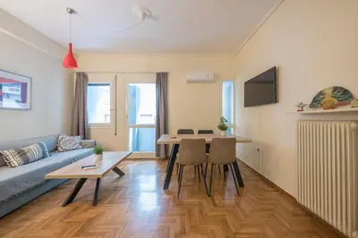 a living room with a couch and a table at Elegant Ariadne, 2 Bedroom Apartment, by Acropolin in Athens