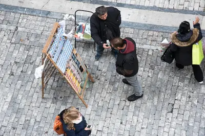 a group of people standing around a table at CentraL44 LoL RooM-Ermou Street in Athens