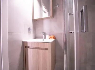 a bathroom with a sink and a shower at Hidden Gem Acropolis View in Athens