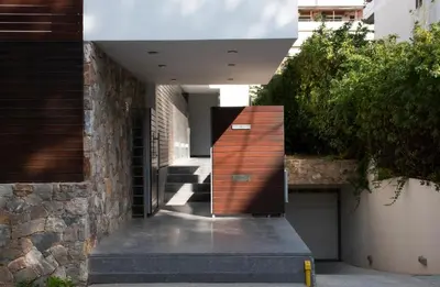 a hallway of a house with a wooden door at Elegant and Private Living by Neuvel in Athens