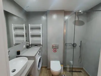 a bathroom with a shower and a toilet and a sink at Argous - Athens City Center Apartment in Athens