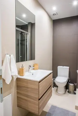 a bathroom with a sink and a toilet at A25 Pristine & Sunny flat with balcony at downtown Athens in Athens