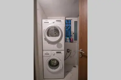 a washing machine and a washer in a bathroom at A26 Premium flat near Monastiraki square in Athens in Athens