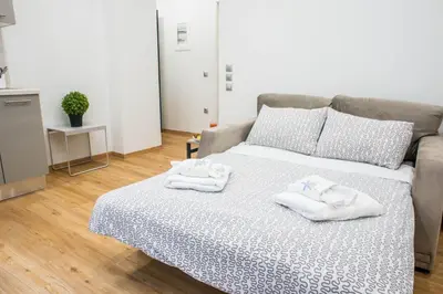 a bedroom with a bed with towels on it at A26 Premium flat near Monastiraki square in Athens in Athens
