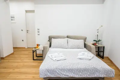 a bedroom with a bed with towels on it at A26 Premium flat near Monastiraki square in Athens in Athens