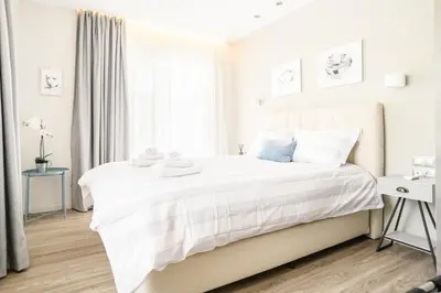 a white bedroom with a white bed and a window at A15 Premium appartment up to 4ppl next to Parthenon! in Athens
