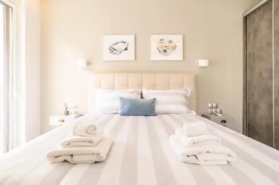 a bedroom with a bed with towels on it at A15 Premium appartment up to 4ppl next to Parthenon! in Athens