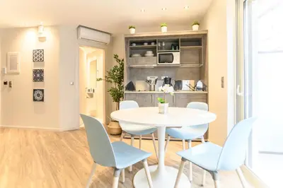 a dining room with a white table and chairs at A15 Premium appartment up to 4ppl next to Parthenon! in Athens